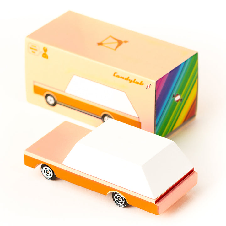 Candylab's orange-and-white Dart Wagon wooden toy car, ready for fun.