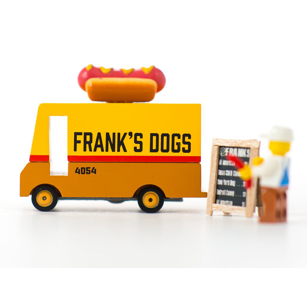 Candylab hot dog van with Lego figure, a wooden toy food truck for toddlers.