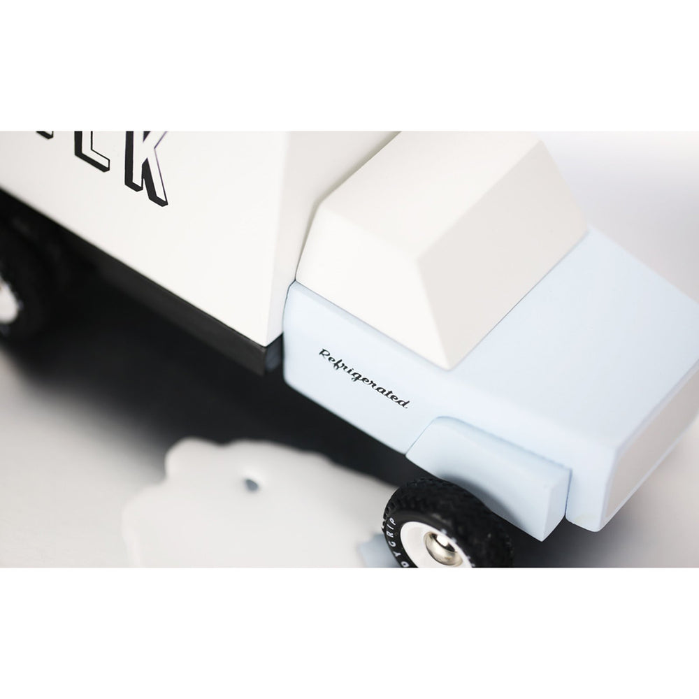 Close-up detail of Candylab milk truck wooden pretend play vehicle.