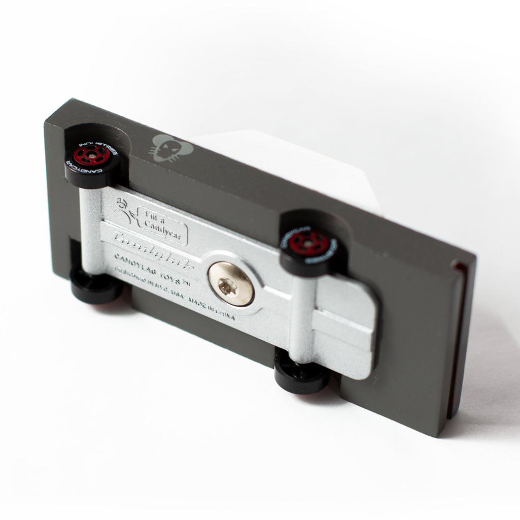 The underside of the Candylab Toys Mouse Rod wooden toy car, showcasing the details of the design.