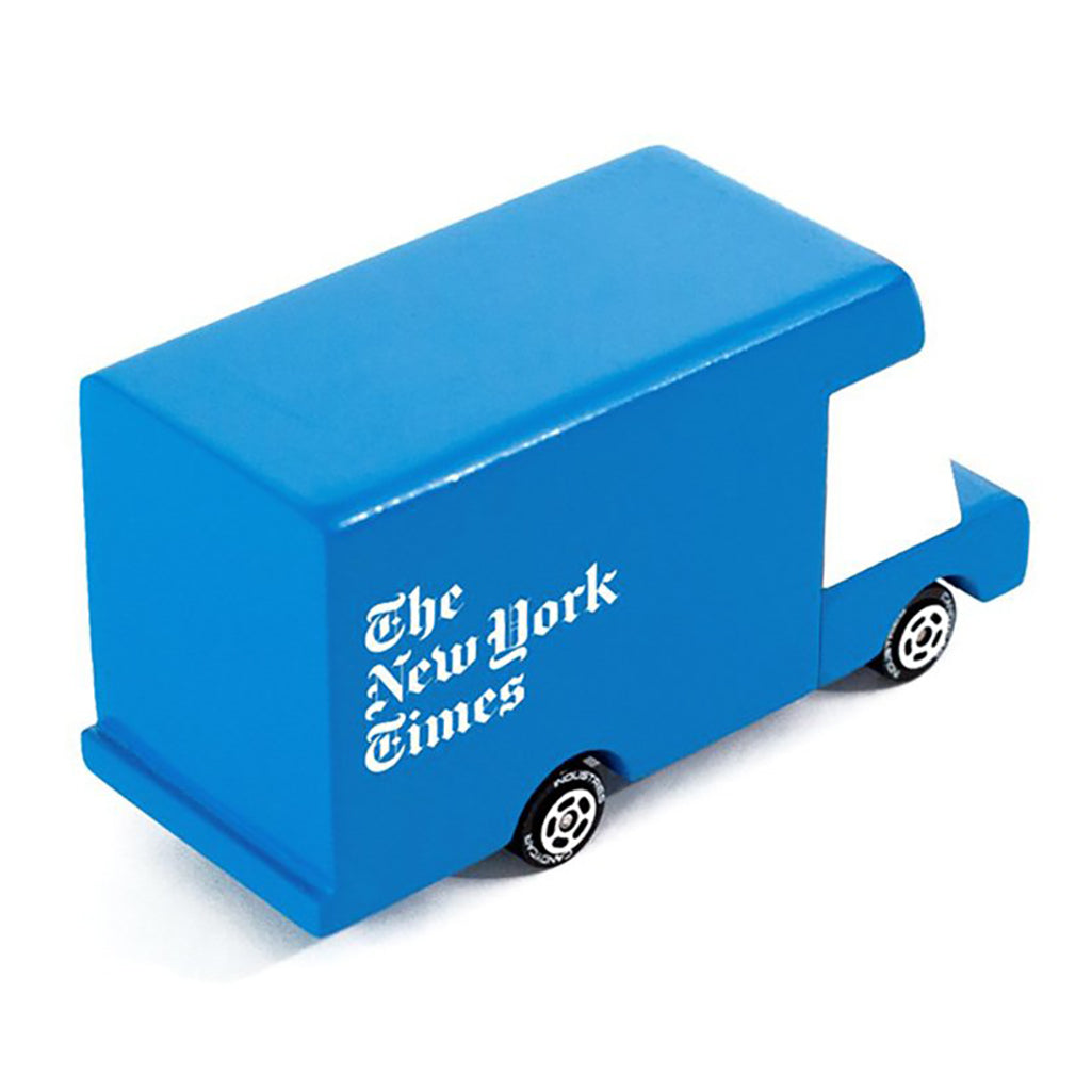 A Candylab Toys wooden New York Times blue van, providing endless pretend-play opportunities for kids.