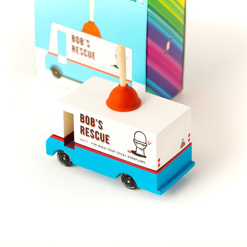 A Candylab Toys plumbing van wooden toy with packaging, perfect for children who enjoy pretend play with vehicles.