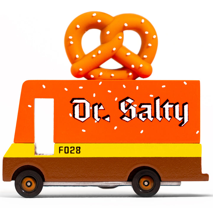 A wooden Candylab Toys Pretzel Van, shaped like a food truck for kids to use in their pretend play.