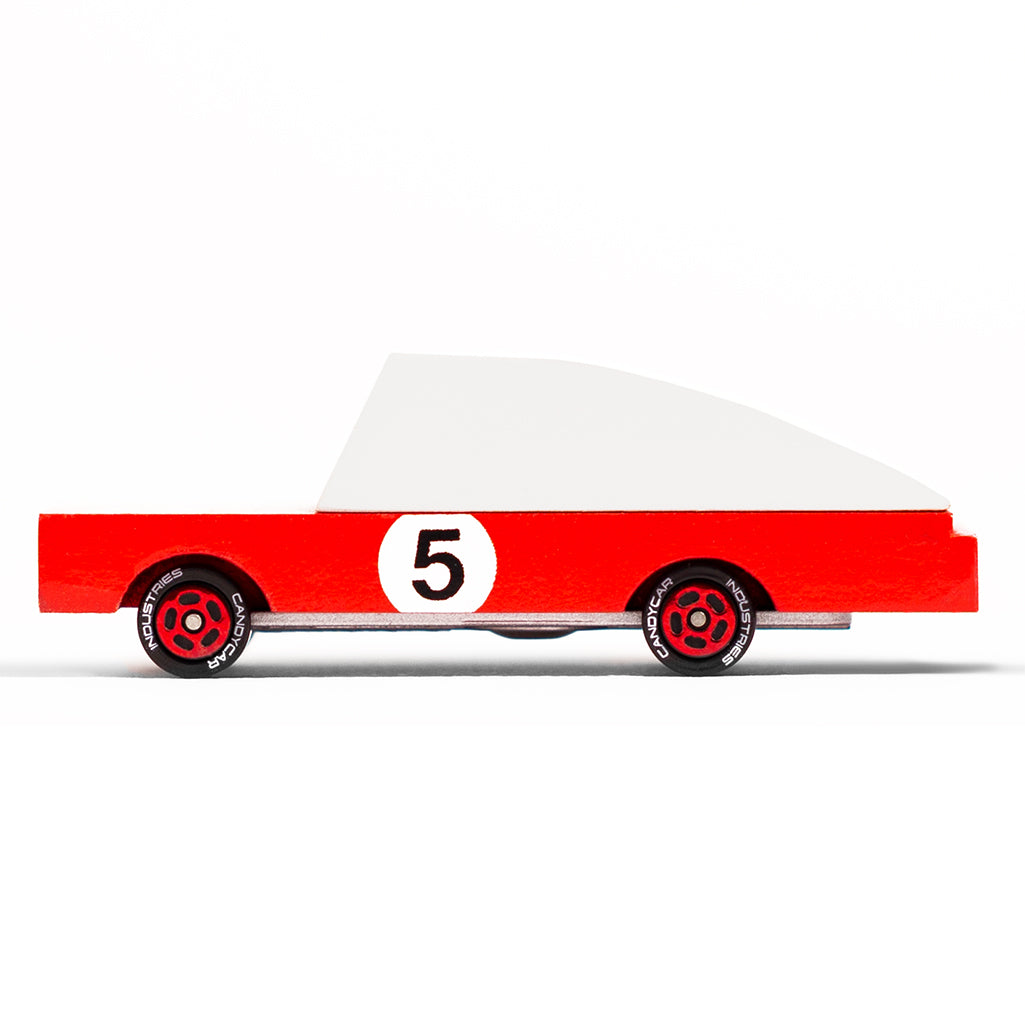 A red wooden racer car labeled #5 by Candylab Toys, designed for childrenÕs racing and playtime adventures.