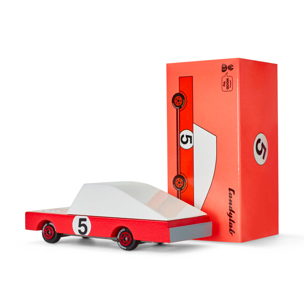 A Candylab Toys Red Racer #5 wooden car, packaged with its box, perfect for kids to engage in race car play.