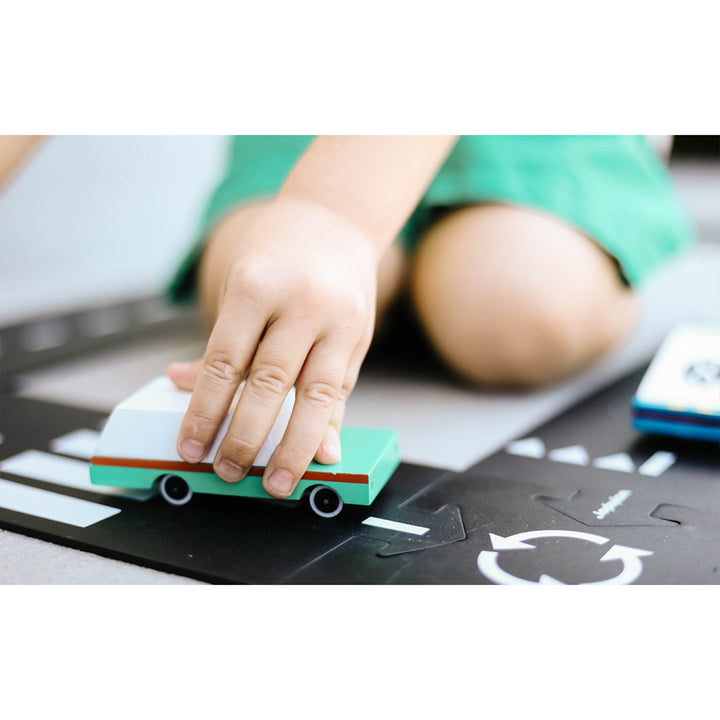 Child playing with Candylab Toys Teal Station Wagon Wooden Car Toy, showcasing kids enjoying pretend play with this classic toy.