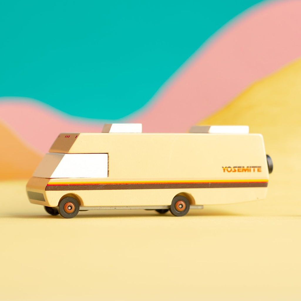 Candylab Toys Yosemite RV Wooden Toy, a bright yellow camper van for fun and stylish pretend play