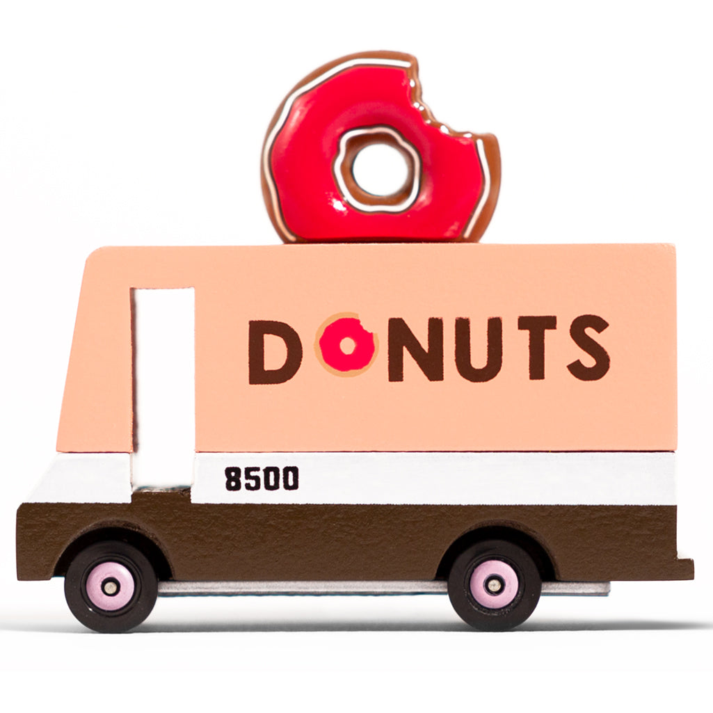 Side view of the pink and white Candylab donut van a fun wooden food truck toy for kids