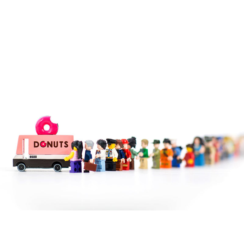 Candylab wooden donut van displayed with miniature toy figures for creative storytelling