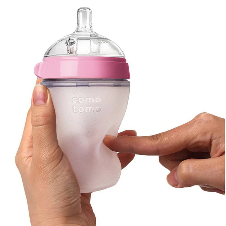 Best bottles for breastfed babies featuring Comotomo pink bottles