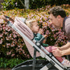 Dad and Child Playing in Uppababy CRUZ V2 Stroller in Alice Pink