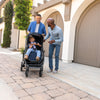 Dads Walking Son with Uppababy Cruz V2 Stroller in Noa Blue