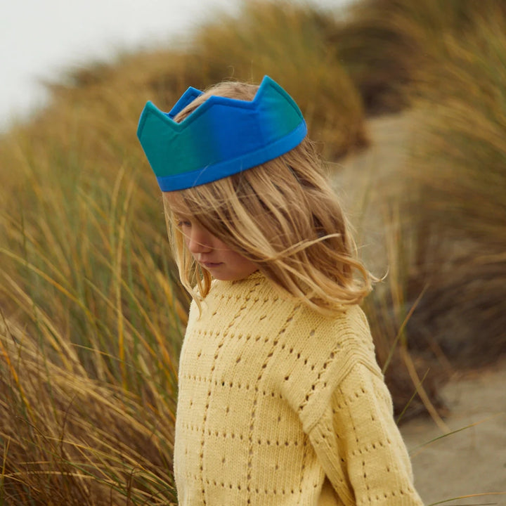 Sarah's Silk Ocean Silk Crown Children's Pretend Dress-Up Crown. Modeled on child with blond hair and yellow sweater outside.