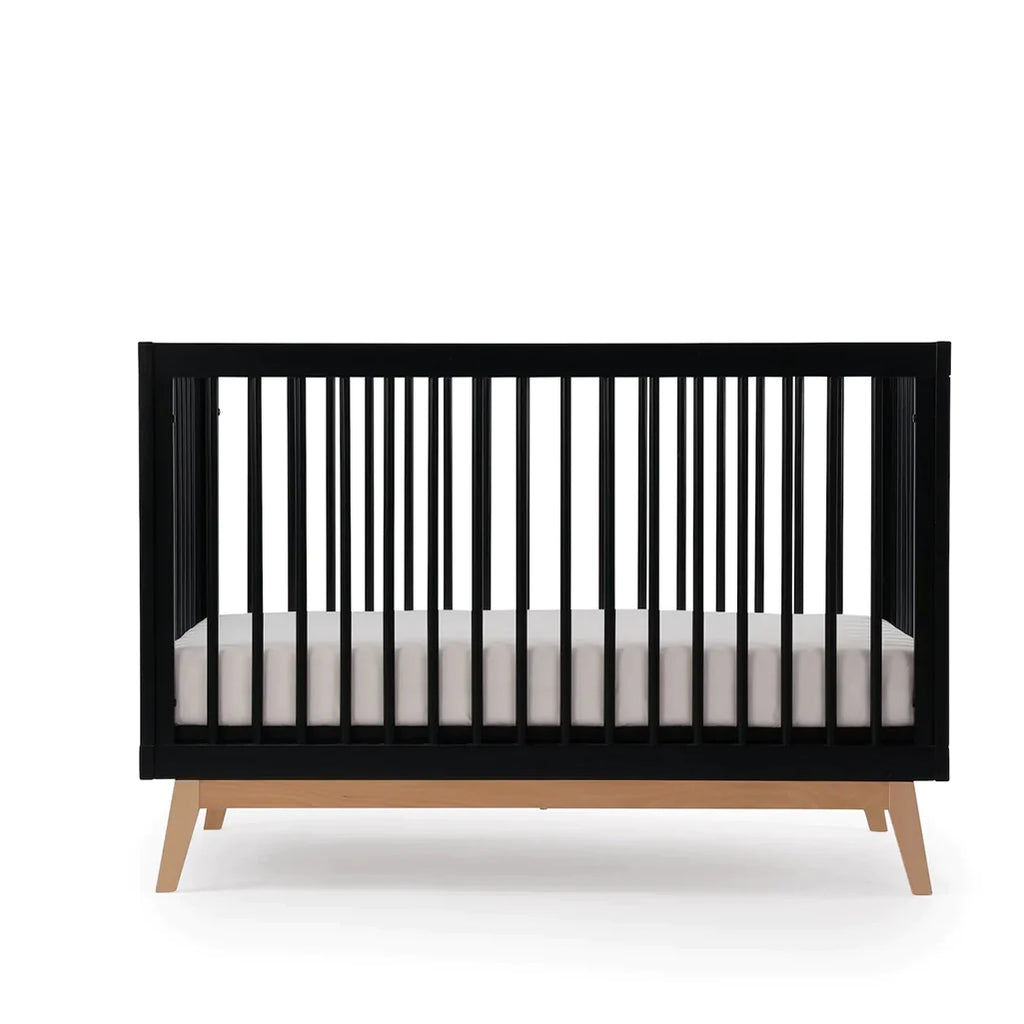dadada Black/Natural Soho 3-in-1 Convertible Crib. Black crib with natural colored legs. Toddler bedroom furniture