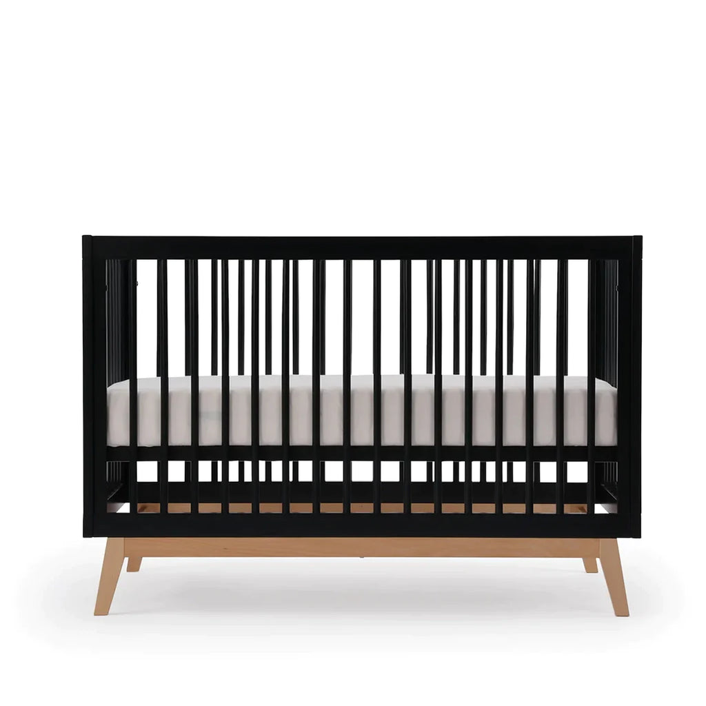 dadada Black/Natural Soho 3-in-1 Convertible Crib. Black crib with natural colored legs. Front view.
