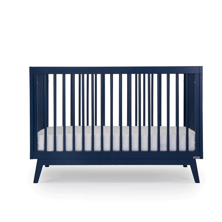 Front display of the Dadada Soho 3-in-1 Convertible Crib in denim finish shown as one of the best cribs.