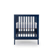 dadada Denim Soho 3-in-1 Convertible Crib to Toddler Bed Furniture. Navy blue in color. Profile view.