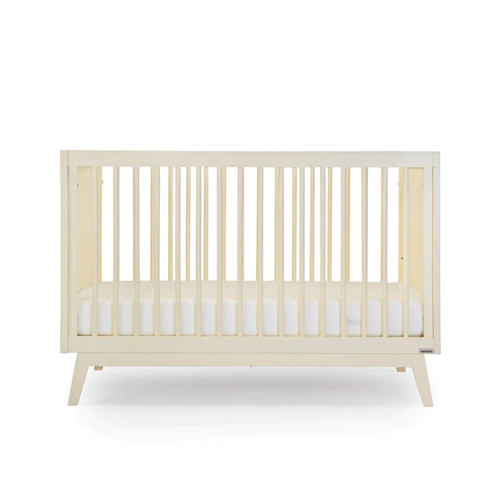 Front view of the Dadada Soho 3-in-1 Convertible Crib in meringue finish highlighted as one of the best cribs.