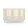dadada Meringue Soho 3-in-1 Convertible Crib to Toddler Bed Furniture . Light creamy yellow in color. Face view.