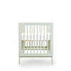 dadada Sage Soho 3-in-1 Convertible Crib to Toddler Bed Furniture. Pastel green in color. Profile view. Baby cribs for sale