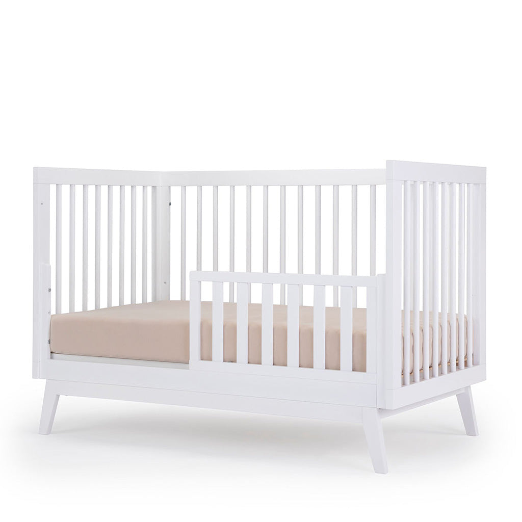 dadada White Soho 3-in-1 Convertible Crib to Toddler Bed Furniture. Shown converted into a Toddler Bed.