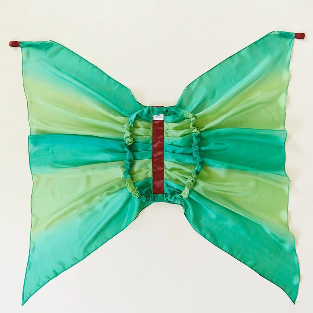 Sarah's Silks Forest Fairy Wings Children's Dress-Up Accessory. Ombre emerald green and lime green silk fairy wings. Medium brown silk band in the middle and finger loops on top of wings. Image showing the backside of the wings showcasing the elastic arm loops.