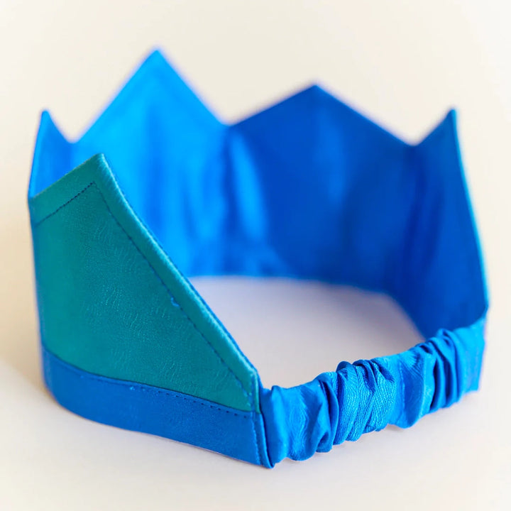 Sarah's Silk Ocean Silk Crown Children's Pretend Dress-Up Crown. Ombre blues silk crown with elastic band. Back view showing the elastic band.