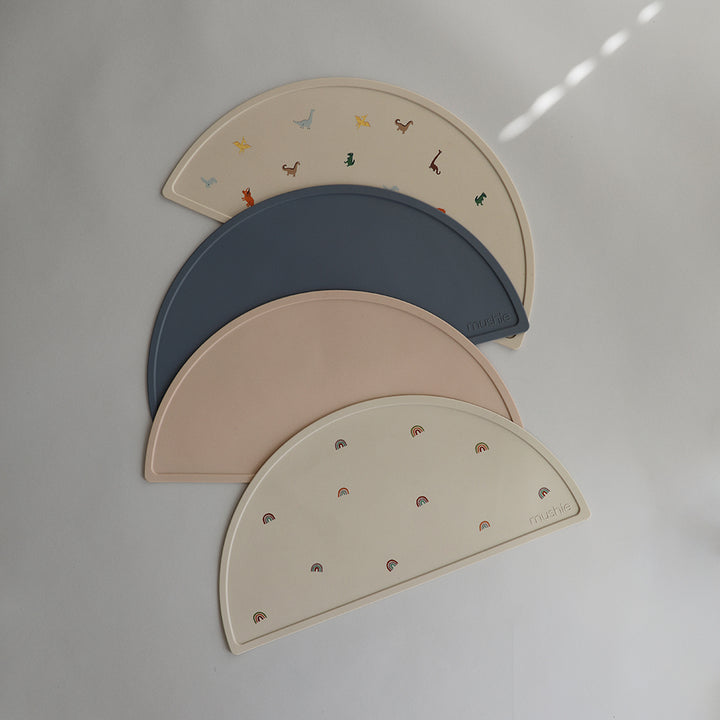 Mushie Assorted Baby Placemat A mix of different placemats each offering practicality and style