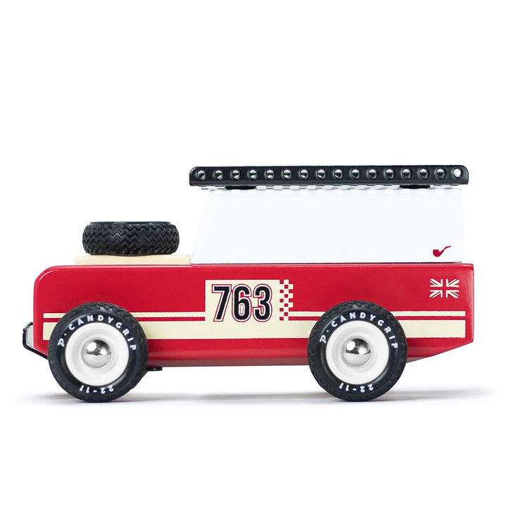 Side profile of the red Candylab Drifter Nigel wooden toy car.