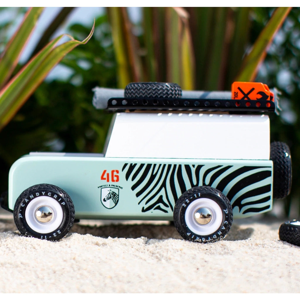 Adventure Zebra SUV toy by Candylab, shown with accessories.