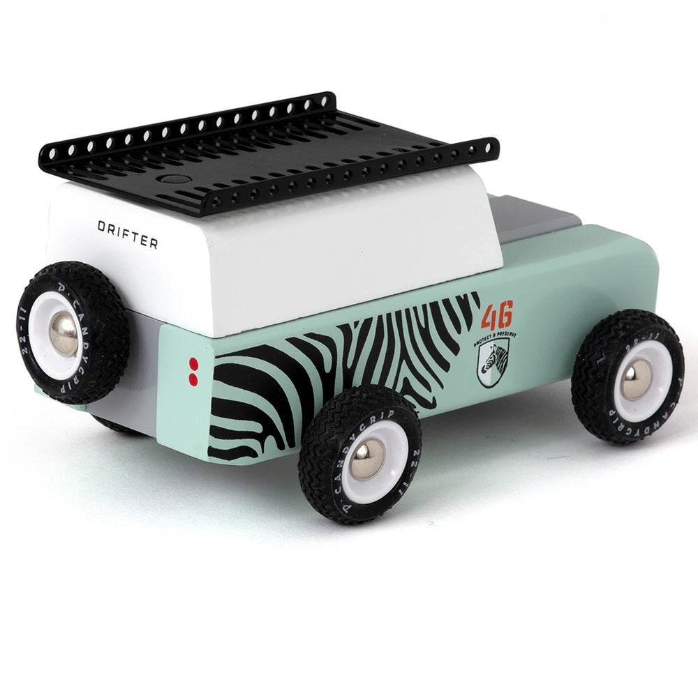 Back view of the Adventure Zebra car, featuring luggage racks and spare tire.