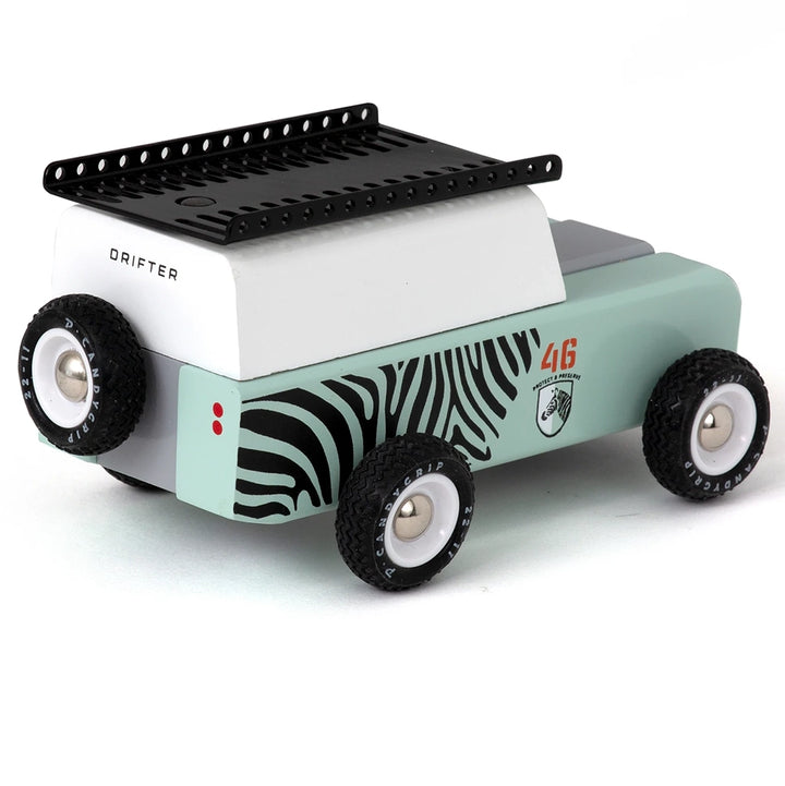 Back view of the Adventure Zebra car, featuring luggage racks and spare tire.
