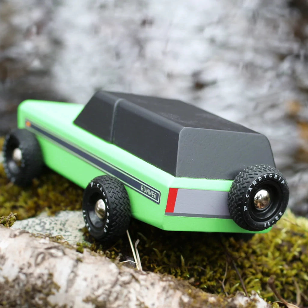 A Candylab Runner vintage wooden toy vehicle displayed outdoors, perfect for children's role-play adventures.