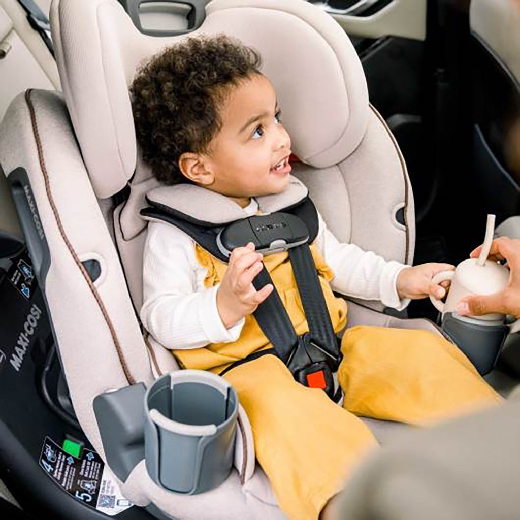 toddler riding in maxi-cosi rotating convertible car seat