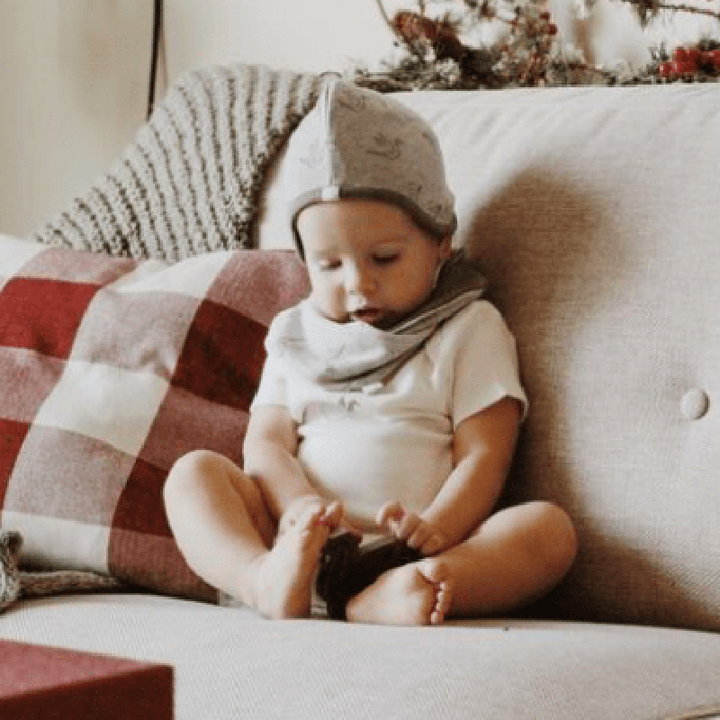 Keep your little one cozy with the Finn + Emma Organic Reversible Baby CapÑan eco-friendly essential among modern baby hats.