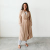 Goumikid's Sandstone Bamboo Organic Cotton Women's Robe. Light brown women's robe with sewn-in tie. Featured on model.