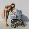 Mom Using Uppababy Cruz Stroller with Bassinet Accessory