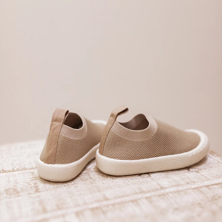 Mrs Ertha's Harbor Mocs Children's Slip-on Summer Shoes shown on a pedestal. 