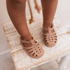 Mrs Ertha Blush Floopers Children's Silicone Summer Sandals modeled on child.