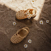 Mrs Ertha Honey Boo Floopers Children's Silicone Summer Sandals shown outside in sand with flowers.