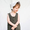 child wearing light grey KyteBaby Linen Bonet Hat 