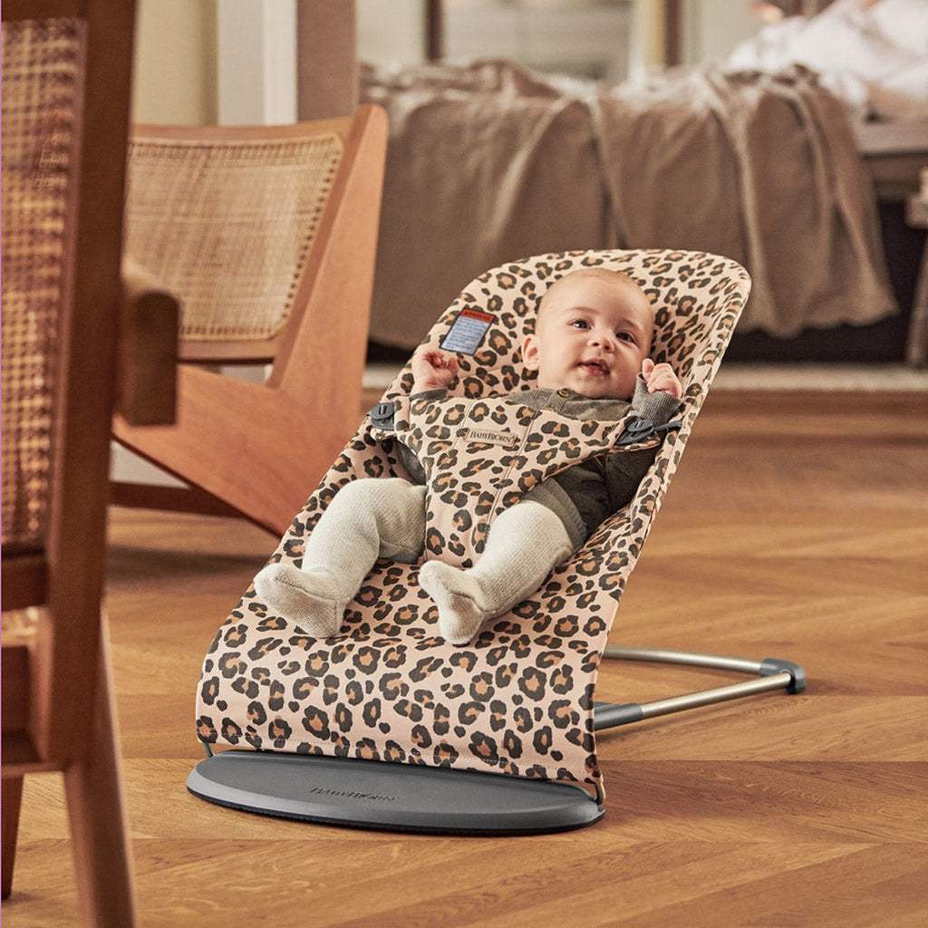 Baby in BabyBjorn Bouncer Bliss in Leopard with Ergonomic Natural Movement Rocking
