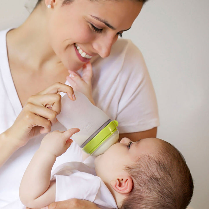 Green Comotomo baby bottle for newborns and infants