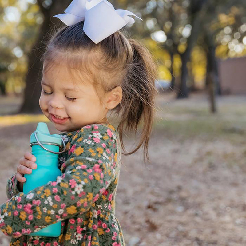 Klean Kanteen sippy being held by baby