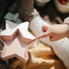 Mushie Nesting Stars for toddlers featuring subtle multicolored hues