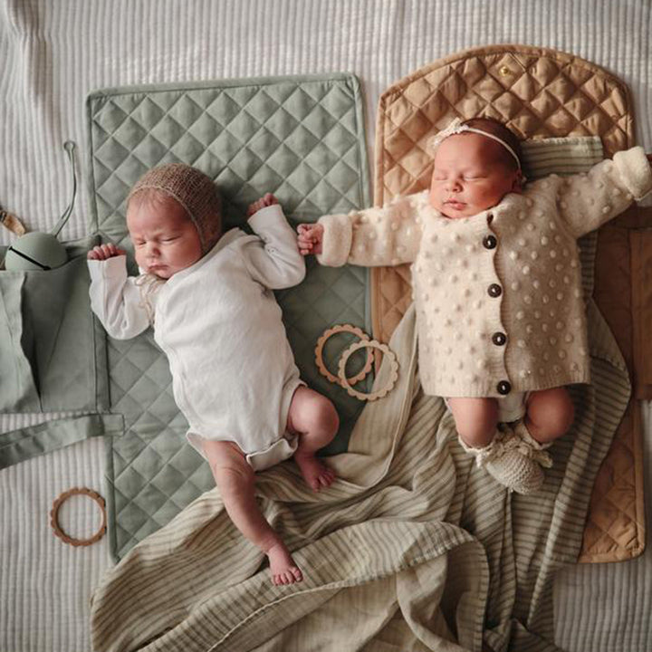 Mushie Baby Pacifier Holder providing a practical and safe way to store pacifiers