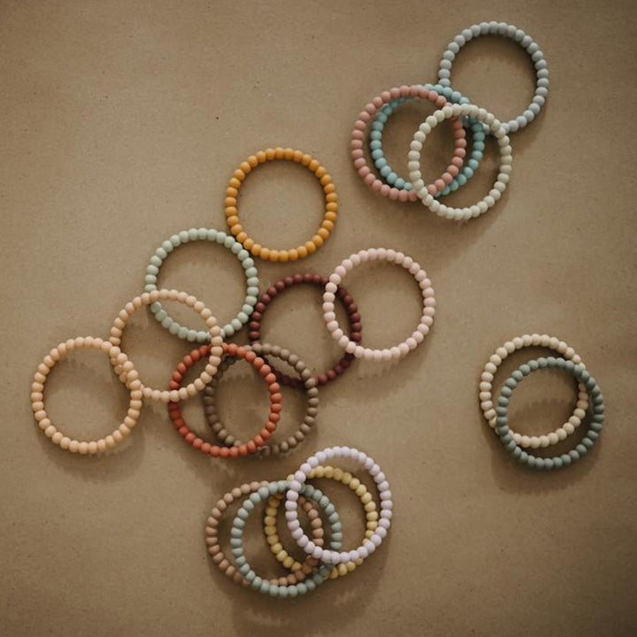 Mushie teething toys combining soothing relief with textures to engage baby senses