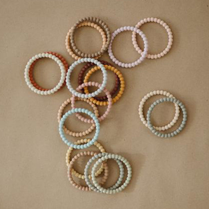 Mushie teething toys for babies crafted to ease gum pain and promote healthy oral development