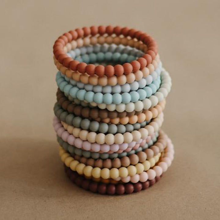 Mushie teething toys made with eco-friendly materials safe for infants and toddlers