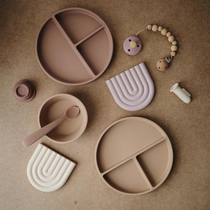 Assorted Mushie teethers offering a variety of soothing and baby-safe teething solutions